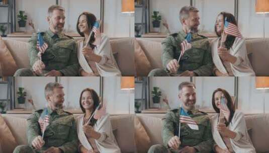 军官和他的妻子挥舞着美国国旗高清在线视频素材下载