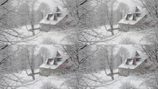 白雪皑皑的森林和房屋高清在线视频素材下载