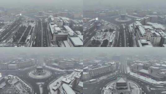 航拍陕西省西安市大雪中的西安钟楼街道景观高清在线视频素材下载