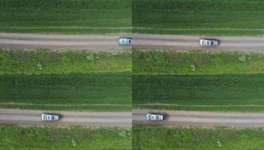 绿色田野行驶的汽车高清在线视频素材下载