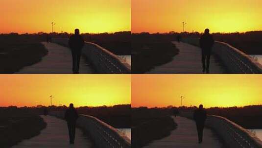 落日夕阳下湖边一个人走向夕阳升格慢镜高清在线视频素材下载