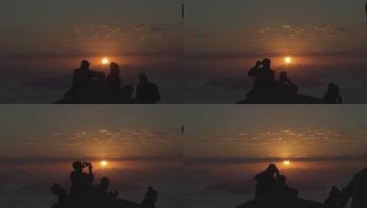 游客在山顶上拍摄日落景色高清在线视频素材下载