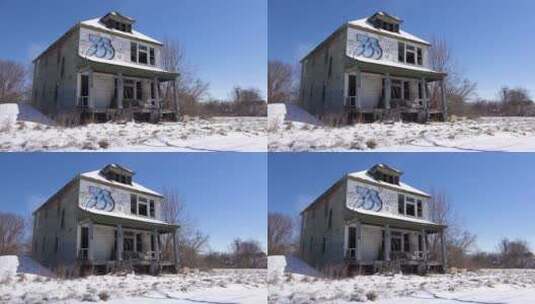 在空旷的土地上的一所被涂鸦覆盖的废弃房屋高清在线视频素材下载