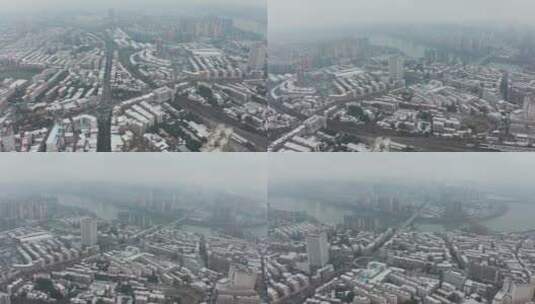 航拍湖南永州冬天城市雪景下雪后的楼顶4K高清在线视频素材下载