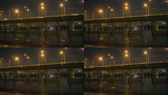 从桥下驶来的夜间车辆高清在线视频素材下载
