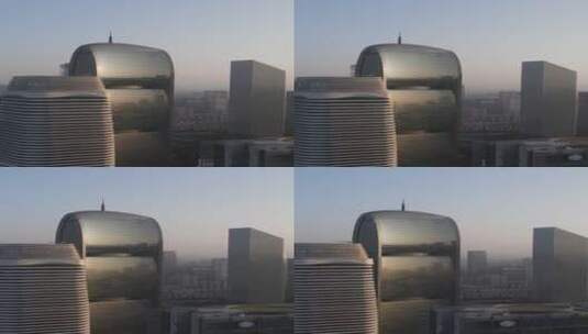 晨晖中的珠江新城高楼群航拍高清在线视频素材下载