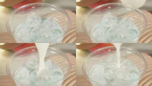 冰杯里倒入椰乳薄荷奶茶饮料高清在线视频素材下载