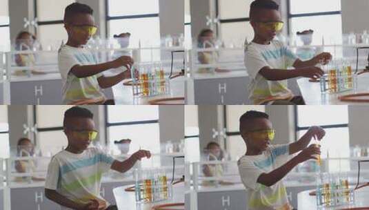 快乐的非裔美国男孩在化学课上戴眼镜的视频高清在线视频素材下载