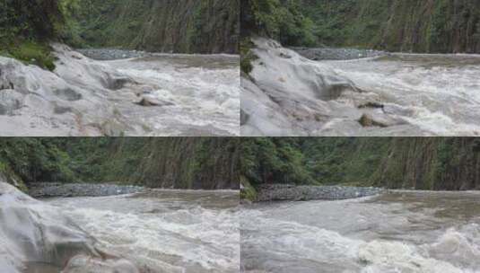 一条流经旁边岩石的河流，有明显的水磨损迹象高清在线视频素材下载
