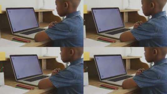 在家的使用屏幕笔记本电脑的男孩高清在线视频素材下载