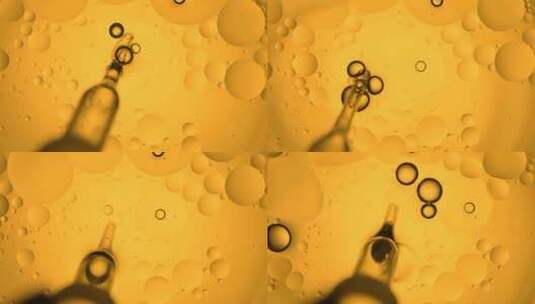 水中的金黄色油分子流动高清在线视频素材下载
