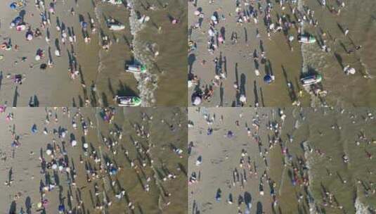 高角度航拍海边沙滩游泳玩耍的人群影子高清在线视频素材下载