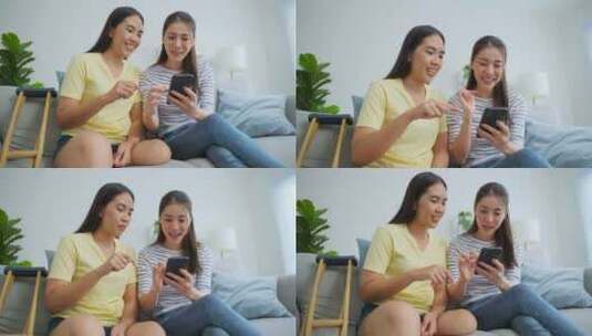 亚洲女性截肢者与漂亮的朋友在家里使用手机。高清在线视频素材下载