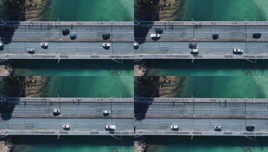 多辆车和人通过一座桥前往塔勒布奇一个受欢迎的度假胜地高清在线视频素材下载