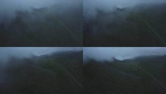 航拍被云雾笼罩的大山高清在线视频素材下载