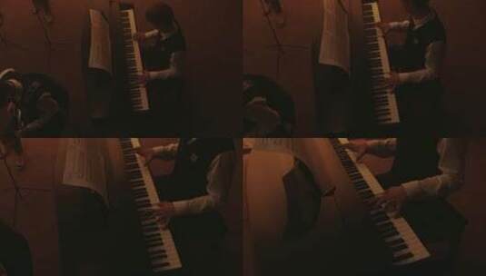 航拍一男孩在弹钢琴高清在线视频素材下载