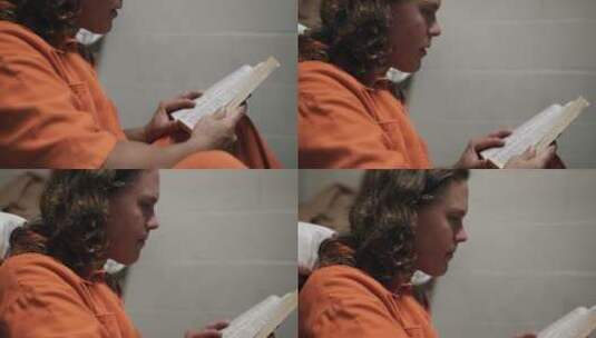 囚犯在监狱里阅读书籍高清在线视频素材下载