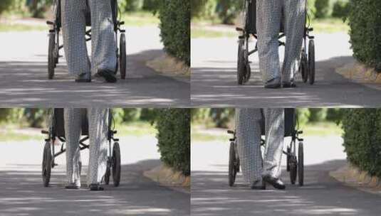 老人推轮椅走路脚步高清在线视频素材下载
