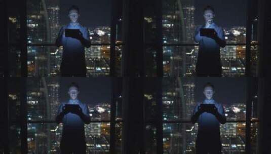 男人在迪拜摩天大楼使用平板电脑高清在线视频素材下载