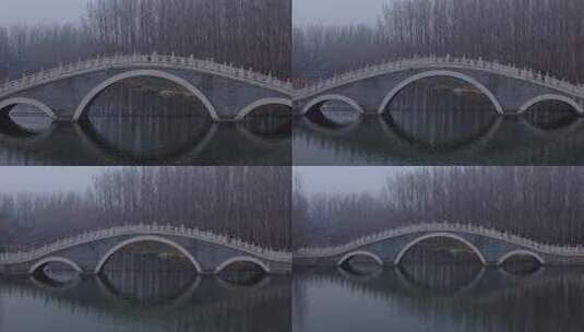公园河流上的大理石拱桥航拍高清在线视频素材下载