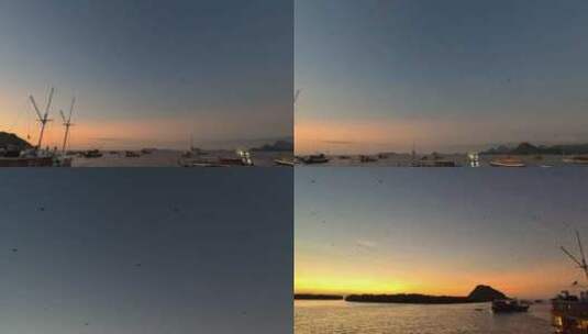 海鸟在游艇上空飞翔巴厘岛日落夕阳晚霞高清在线视频素材下载