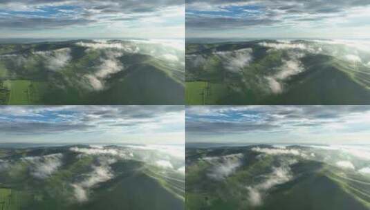 航拍云雾缭绕的绿色山脉高清在线视频素材下载