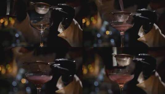酒保将饮料从摇壶中倒入玻璃杯高清在线视频素材下载