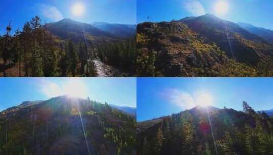 FPV航拍山峰原始森林山顶太阳光线耶稣光山高清在线视频素材下载