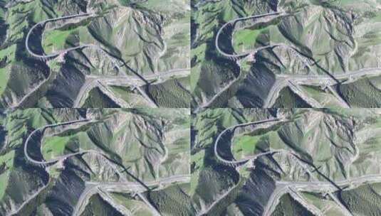 无人机俯拍新疆伊犁高山峡谷中果子沟大桥高清在线视频素材下载