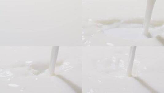 将牛奶倒在白色背景上高清在线视频素材下载