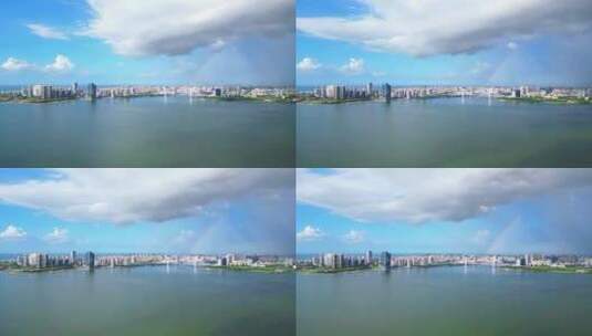 海南海口雨过天晴，航拍城市上空双彩虹高清在线视频素材下载