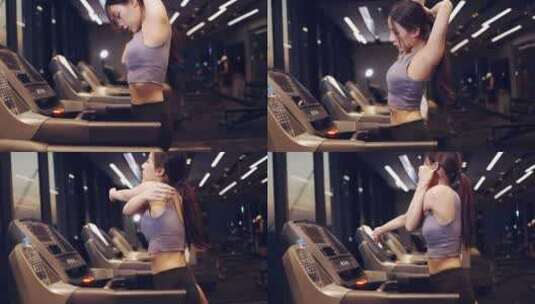 女子在健身房的跑步机上跑步高清在线视频素材下载