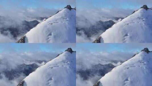 航拍攀登横断山脉乌库楚雪山山脊上的登山者高清在线视频素材下载