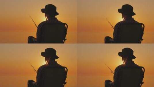 男人坐在海边钓鱼的后视图高清在线视频素材下载