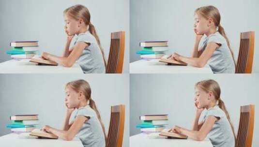女孩在阅读课本高清在线视频素材下载