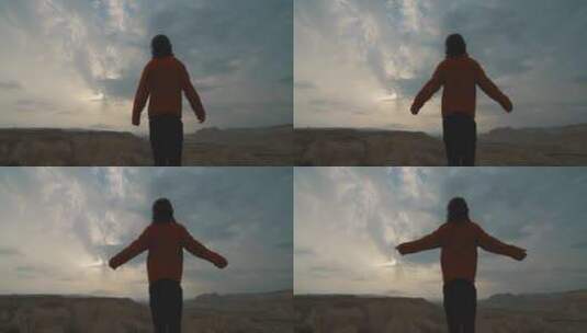 男人在沙漠中张开双臂高清在线视频素材下载