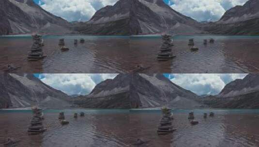 稻城亚丁牛奶海蓝天下山间尼玛石堆湖水荡漾高清在线视频素材下载