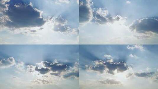 天空云层阳光穿透云朵太阳光芒丁达尔耶稣光高清在线视频素材下载