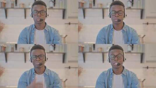 戴耳机的年轻商人与客户交谈高清在线视频素材下载