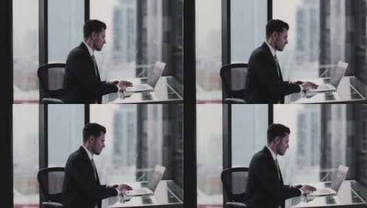 男人在办公室用笔记本工作高清在线视频素材下载