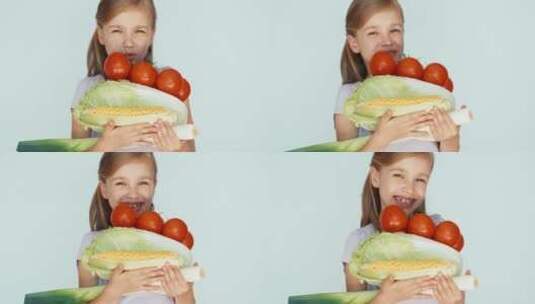 女孩拿许多蔬菜对镜头开心的笑高清在线视频素材下载