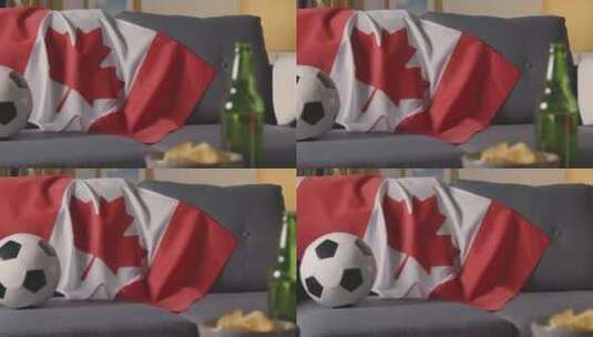 沙发上的加拿大国旗和足球高清在线视频素材下载