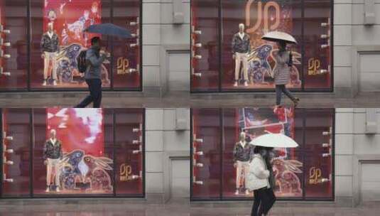 上海南京路下雨天雕像雨中行人高清在线视频素材下载
