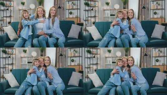 母亲和她的两个女儿在沙发在拥抱高清在线视频素材下载