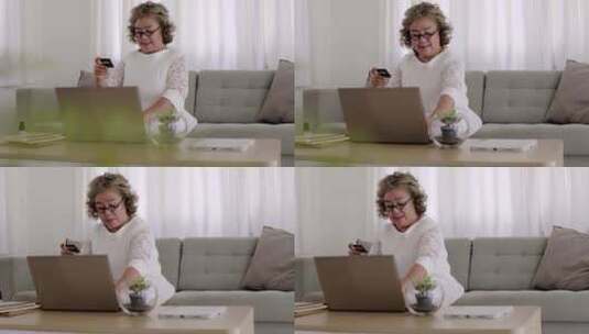 中老年妇女在使用笔记本电脑高清在线视频素材下载