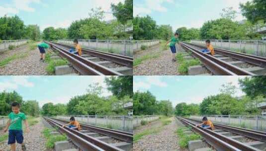 两个小孩在铁路上玩耍高清在线视频素材下载
