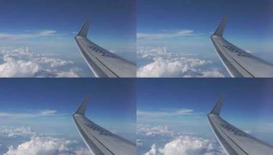 航空飞机在云层之上窗外蓝天白云高清在线视频素材下载