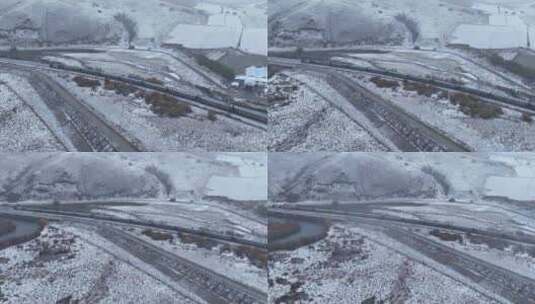 行驶在风雪交加天气的雪原列车高清在线视频素材下载