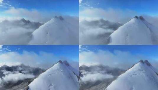 航拍攀登横断山脉乌库楚雪山山脊上的登山者高清在线视频素材下载