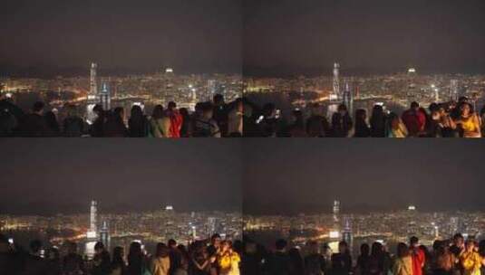 游客太平山顶看香港夜景香港城市夜晚风景高清在线视频素材下载